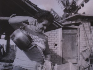 Mrs. Maria Celeste putting hot water over the ashes